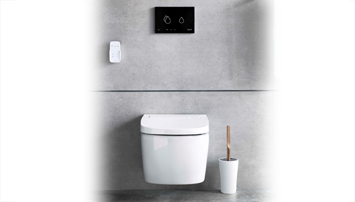 VitrA's Smart Panel Flush Plate is shown with the rimless V-Care shower toilet, which has a sensor that opens the lid as users approach