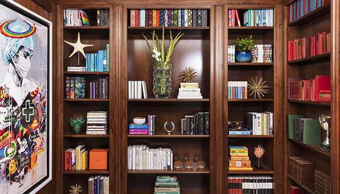 Bespoke library shelves by Clive Christian Furniture stocked with 300 ‘must-read’ titles from Hatchards