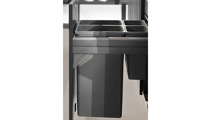 Rotpunkt Raw black cabinetry is pictured with integrated waste sorting system
