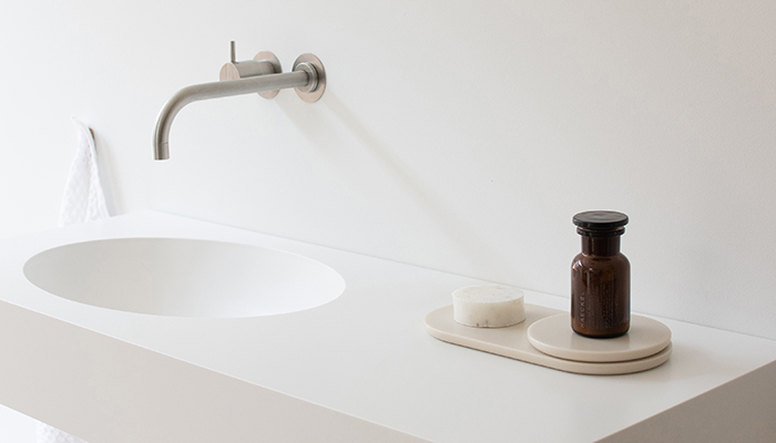 The elegant Hi-Macs washbasin also acts as a display for the new Hi-Macs accessories collection by Not Only White