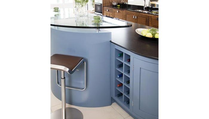 These two Mowlem & Co designs feature an island unit with cubby holes tucked in neatly beside the breakfast bar