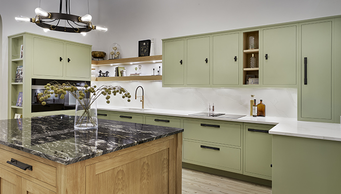 The Linear and Shaker kitchen display is shown with Via Lactea Granite worktops on the island and Aurora Calcatta Gold worktops on the run of wall units
