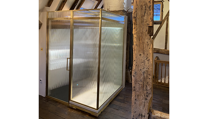 Matki’s Classica bespoke shower and bathroom partition in Brushed Brass with Fluted Glass