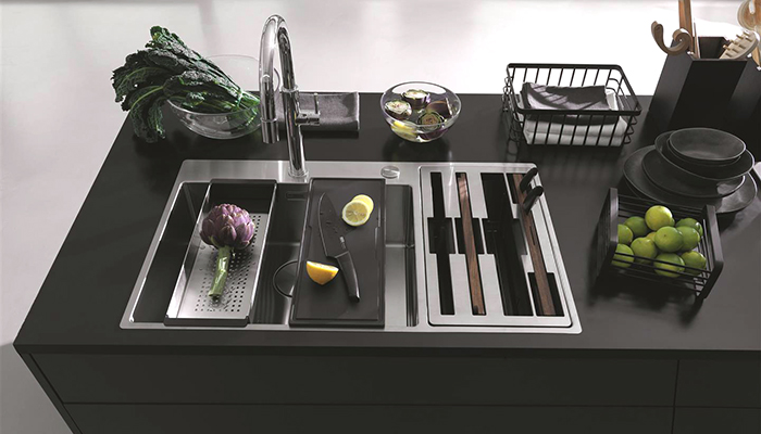 Franke’s Box Center is a double-bowl stainless steel sink that includes knives, knife holder, strainer bowl, food prep platter, chopping board and wire rack