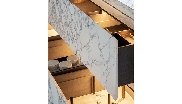 Arabescato marble drawer fronts open to reveal oak interiors