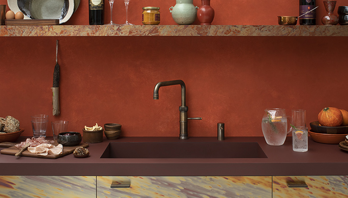 Cold, hot and boiling water are all dispensed in Quooker's Classic Fusion Square tap, shown here in a patinated brass finish