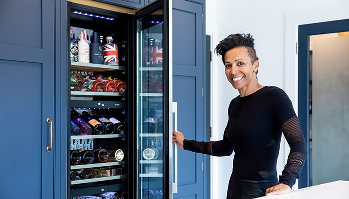 Dame Kelly with her Caple in-column triple zone wine cooler – AKA her gin fridge