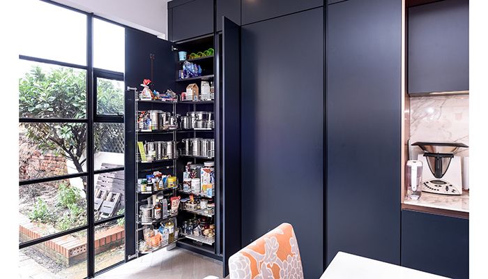 Rotpunkt’s larder cabinet, shown here in cabinetry finished in custom blue lacquer, offers copious storage – once the door is opened the shelves move forward so they can easily be accessed