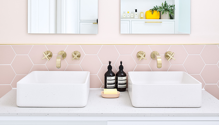 The beautifully textured basins by Kast Concrete contrast well with the more colourful elements of the room