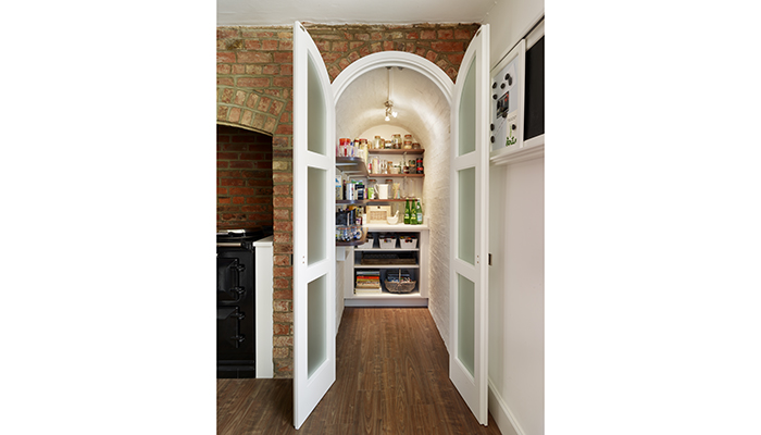 An original coal cellar has been cleverly converted by Simon Taylor Furniture into this stunning walk-in pantry larder in a Georgian House in Buckinghamshire. Photograph by Darren Chung
