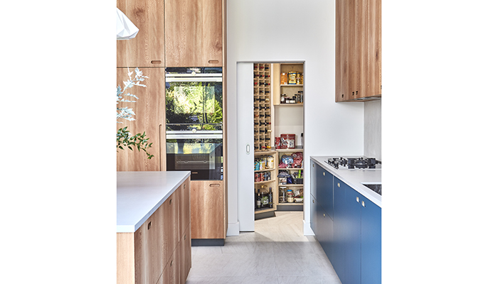 An extension of a stunning Pluck kitchen designed by MW Architects, this walk-in pantry features a large wine rack amongst other storage solutions