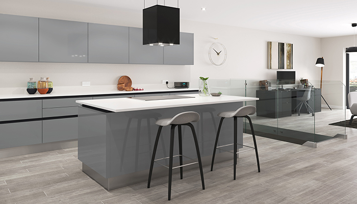 A perfect pairing of neutral tones, this sleek zonal open-plan multifunctional kitchen design is Crown Imperial’s Furore Pale Grey gloss with black handleless profiles, is complemented with Lifespace Zeluso Black furniture