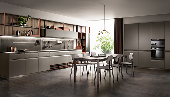 Scavolini’s latest range, Formalia, in Titanium Grey matt lacquer features metal finger-pull handles for a handleless look. Here it’s been teamed with the Status Wall System with a rust-coloured frame to make a bold shelving statement
