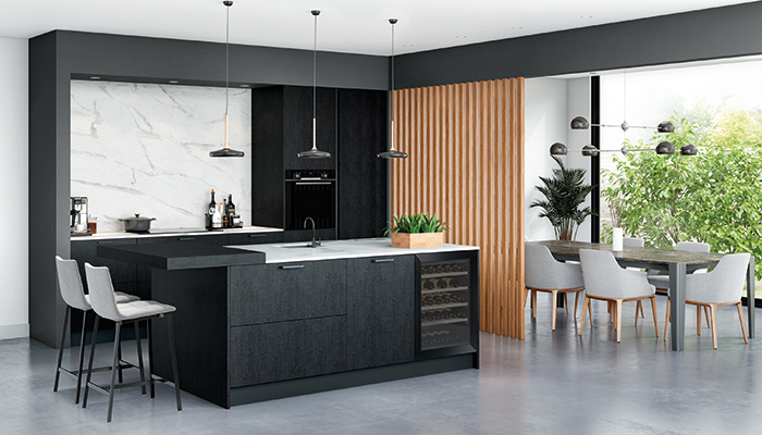 A wooden room divider separates kitchen from dining area in this broken-plan design from Rotpunkt, which includes Coal Black Burned Wood doors with Bow cast iron handles 
