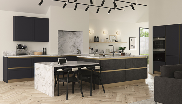 The feature island with dropped level breakfast bar creates another zone in this Cambridge kitchen in Indigo Blue and Smoked Steel from Mereway Kitchens’ Cucina Colore Futura range