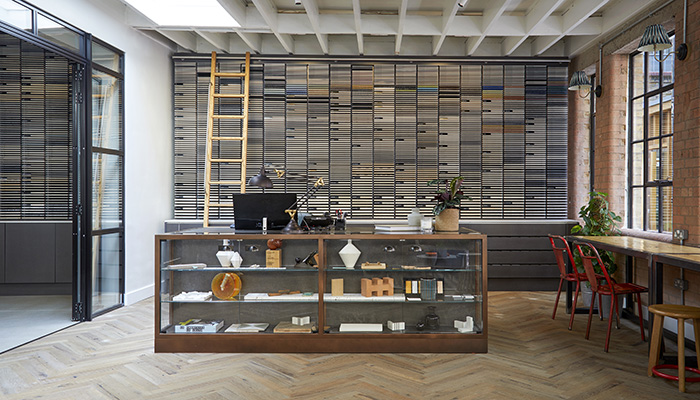 Reception desk in the new showroom, in front of the tile dispensary