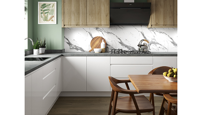Shown here alongside its Omega Brasilia worktop, Alloy by Bushboard in White Marble is a 100% fire-safe, waterproof, decorative aluminium splashback panel. These can be used wall-to-wall to create a sleek and stylish aesthetic meaning that clients don’t need to compromise on quality and functionality