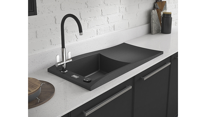 The Swich water filter system can be used to turn a new or existing kitchen tap into a filtered water dispenser, shown here in matt black with a Linear Nero Monobloc mixer tap and London single bowl sink and drainer in black metallic