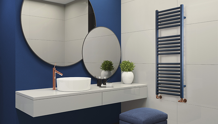 There’s no chrome in sight with MHS Radiators’ stunning Nina towel rail in Denim Blue with Radius corner manual valves in Antique Copper finish. Shown here is the 1160mm x 500mm central heating version, which offers a heat output of 539 watts or 1839 BTU