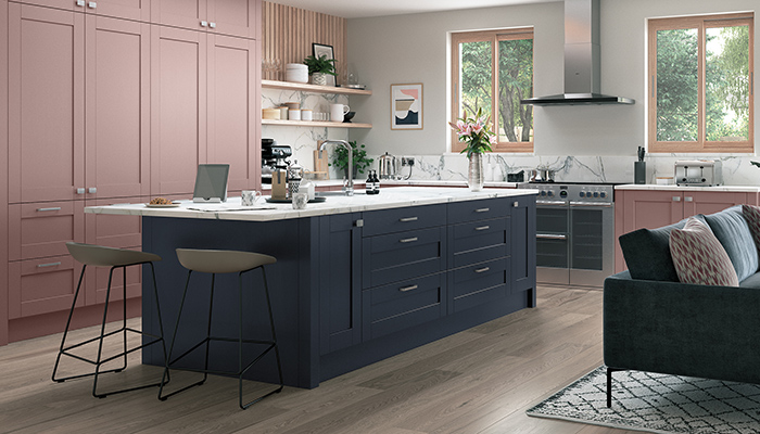 Featuring a timber grain finish, the Aura Shaker-style Mason kitchen contrasts Vintage Pink and Parched Oak with Slate Blue