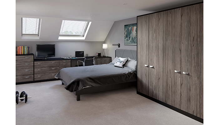 From Crown Imperial’s contemporary Textura collection, the fitted furniture in this multifunctional bedroom features a discreet desk area to create a dedicated workspace. It is finished in Fleetwood with Furore Black