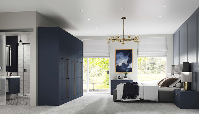 Symphony’s Nebula bedroom furniture range, which includes fitted as well as freestanding units, comes in Matt Indigo, pictured, as well as Matt Pebble and with a choice of brass or titanium handles
