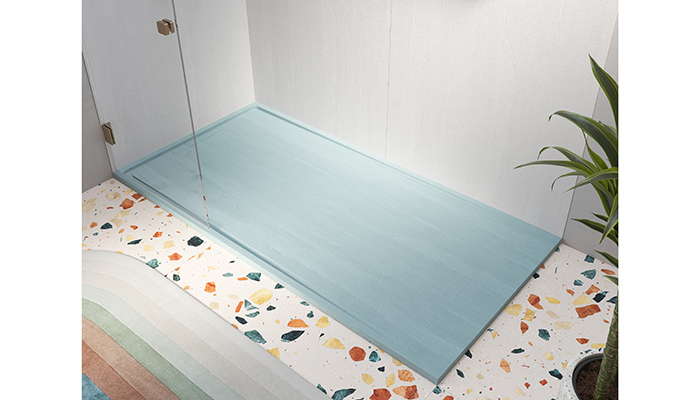 Acquabella’s made-to-measure Tempo Arabba shower tray, seen here in Abstract Blue, has been designed so that water flows to the sides and then drains through the discreet grate