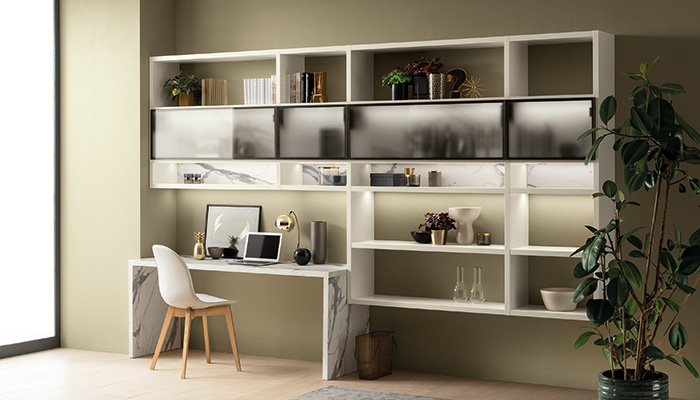 Scavolini’s collections are designed for all areas of the home. This work space utilises its DeLinea range with the Fluida wall system in Pure White melamine and smoked glass doors joined by a desk and wall panels in Statuario laminate