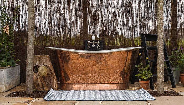 Featured at Farmstead Glamping in Dorset, William Holland’s luxurious Copper Bateau bath is perfectly made for two and handcrafted from pure copper