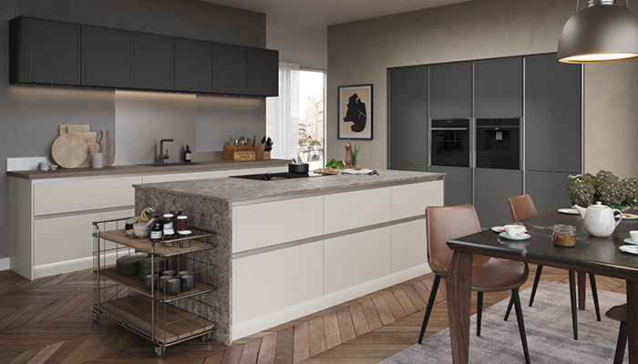 Maintaining a sleek, clean look, Masterclass Kitchens’ smooth, silk painted flat slab Melrose door in Highland Stone and Lava is teamed here with Milano Earth Stone and Ligna Florence Oak worktops 