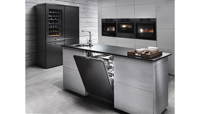 Seen here in black steel, the new built-in Craft range is complemented by the co-ordinating wine centre, which can be freestanding or built-in