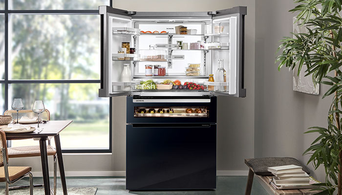 Finished in sleek black glass, Siemens’ iQ700 KF96RSBEA American-style multiDoor fridge-freezer has a generous 572L capacity. Consumers using the Home Connect app can be notified if one of the doors has been left open or the temperature needs adjusting, which can be done remotely. It also has a beverage drawer with oak racks that can store 17 bottles at five temperatures