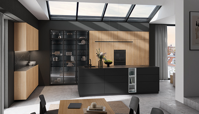 Rotpunkt’s clever hidden door mechanisms mean that a multitude of less desirable kitchen functions can be concealed, while still offering easy access. Shown here is the Memory RI vertical groove range of doors, available in five colour options