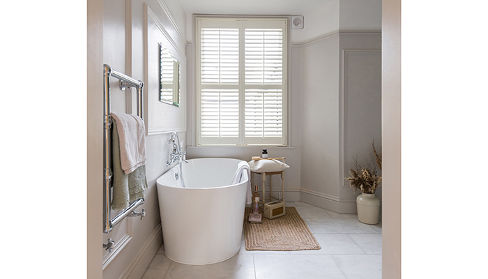 Relocating the bath to beneath the window created a tranquil bathing area, and moved the BC Designs Viado bath into a prominent position
