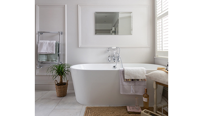 The BC Designs Viado bath is shown here with a Bayswater classic chrome towel rail and an Origins Living Porterhouse Mirror