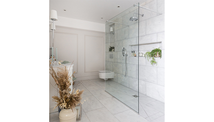 The new layout relocated the Saneux wall-hung Austen WC to a discreet corner, seen here in front of Simply Bathrooms wooden panelling painted in Farrow & Ball Purbeck Stone