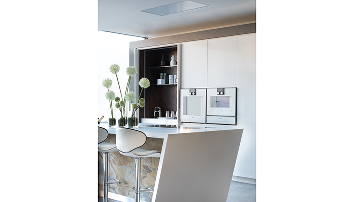 Gaggenau appliances next to a pocket door larder 