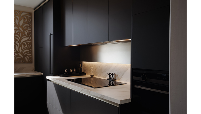 Black cabinetry balanced with Neolith worktops in the Elements display at The Wood Works' Ascot showroom