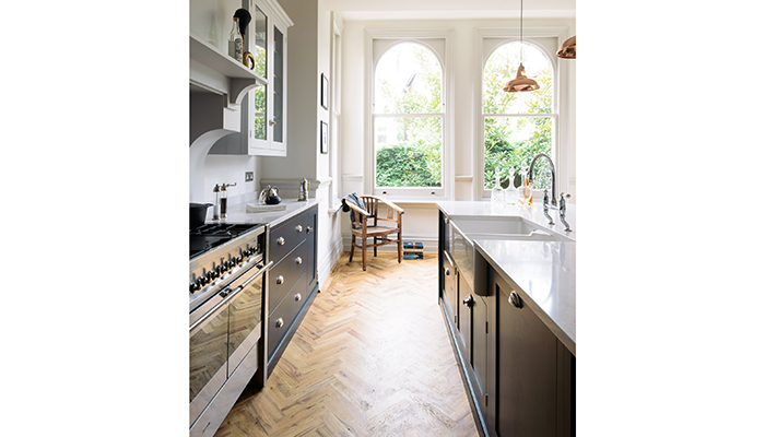 Although at the front of the Crystal Palace property, this kitchen by DeVol benefits from the privacy provided by a formally planted, walled garden. Paintwork in sophisticated Pantry Blue and Damask paintwork has been teamed with with pale Silestone worktops and parquet flooring from sister company Floors of Stone