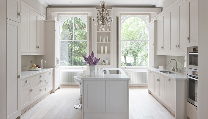 The renovation of this impressive period property bordering Clapham Common features a timelessly elegant new kitchen at the front of the house, by Mowlem & Co. The designers came up with a sophisticated, ultra-functional yet subtle solution with a Gaggenau induction hob flush fitted into the countertop of the island unit, along with a pop-up Elica Adagio downdraft extractor. A Miele oven and combi microwave are wall mounted within easy reach of a large stainless steel Sterling sink with a Franke Olympus tap. The Gaggenau fridge and freezer, plus a Miele dishwasher are built-in behind the vanilla cream units