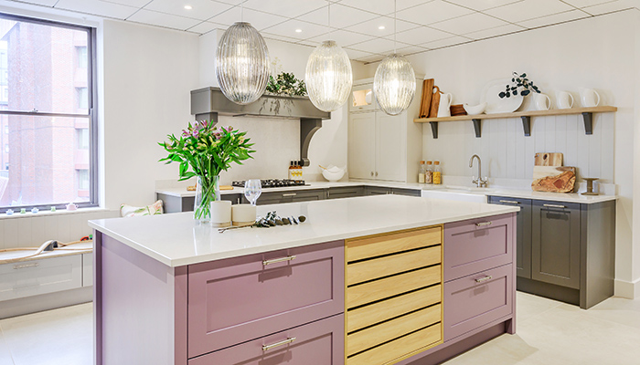 Masterclass kitchen furniture Hardwick in Wisteria Lava and Highland Stone, with Portland Oak Crate Drawers and Silestone worktops in Snowy Ibiza, and Blanco's Vicus Twin Lever Tap in brass and Blanco VILLAE Farmhouse Double Sink