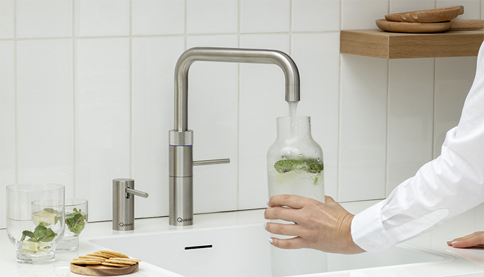 The Fusion Square boiling, hot and cold tap can also dispense chilled sparkling water when combined with a Cube, shown here with matching soap dispenser