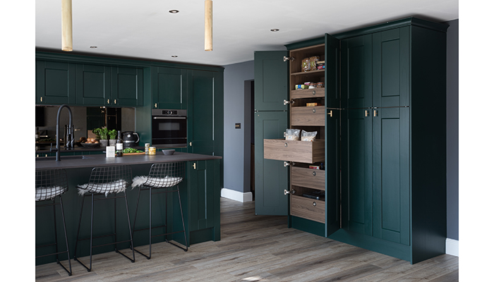 Choosing vertical storage allows designers to maximise space in a kitchen. The SpaceTower larder from Masterclass Kitchens boasts easy-to-use internal drawers that are concealed behind double doors. It’s available in three finishes, shown here in Solva Hunter Green with Tuscan Walnut cabinetry
