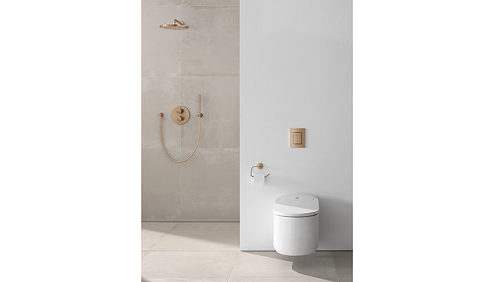 Bathroom featuring Grohe Rainshower Cosmopolitan 310 head shower set in Warm Sunset, and Sensia Arena shower toilet