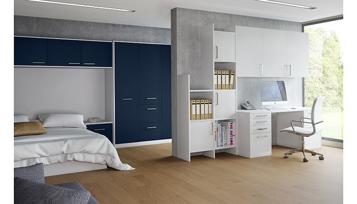 With multifunctional rooms becoming increasingly popular, Crown Imperial’s contemporary Zeluso range allows clients to match bedroom and home office furniture within one space. Here, matt Midnight Blue floor-to-ceiling wardrobes and over-bed storage is combined with a white desk and units 