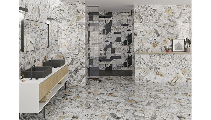 Ceracasa describes its Jade collection as an 'exotic marble' – Jade Gold Gloss (40.1 x 98.2cm) is shown in the foreground in the bathroom area, while Deco Jade Glass (same dimensions) is seen in the showering area