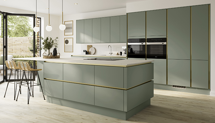 The Hockley super matt handleless kitchen from Howdens is seen here in Reed Green