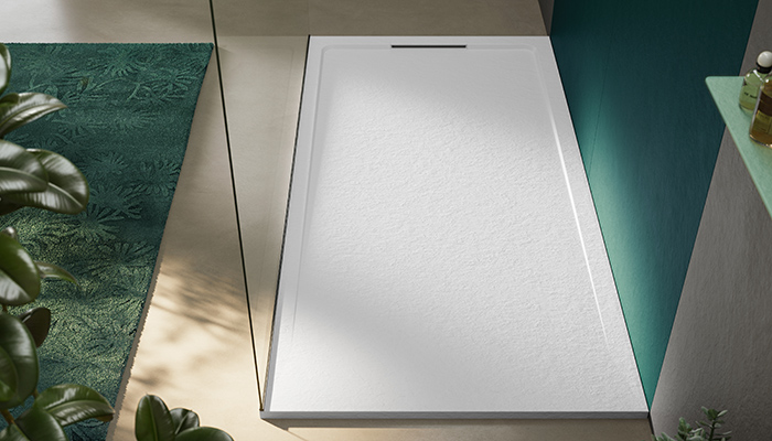 The Halo Slate Blanco shower tray from Acquabella includes an elongated grate that is seamlessly integrated into the frame while its gently sloping shower tray creates fast-flowing water drainage