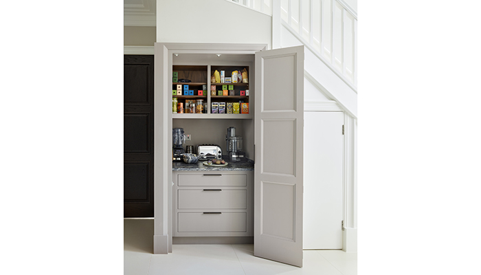 Martin Moore has designed a purpose-built breakfast and coffee station with cabinetry from their New Deco Kitchen Collection. The cupboard takes full advantage of all available space, neatly incorporating drawers for added storage