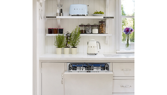 The 60cm-wide DI323BL fully integrated dishwasher has up to 13 place settings. Also pictured are Smeg’s retro-style kettle and toaster 